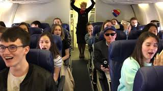 Plainfield North choir sings on a plane [upl. by Lyndel]